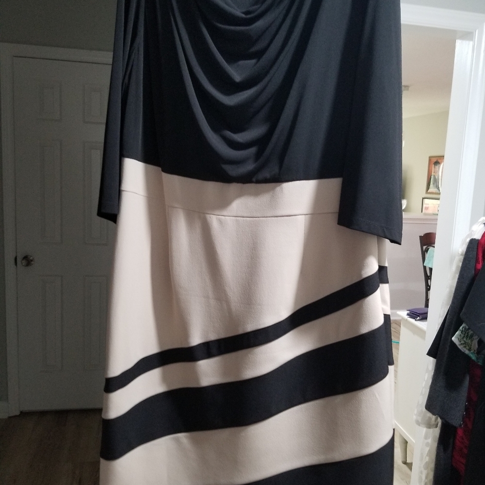 One piece dress Black, tan bottom, swooped neckline.